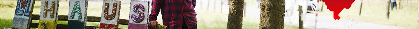Foto einer jungen Frau und ein illustriertes Westfalenherz mit der Aufschrift "Wir unternehmen Gutes"